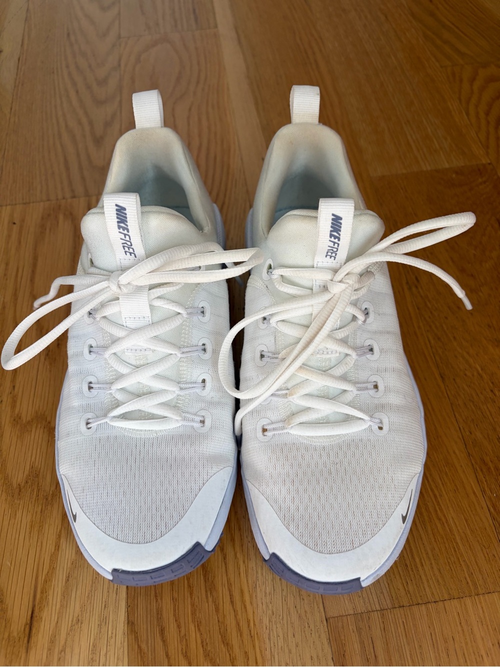 Nike Womenβs White Athletic Sneakers with Light Blue Accents
